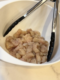 Bite-sized chicken pieces seasoned with olive oil, salt, pepper and garlic.