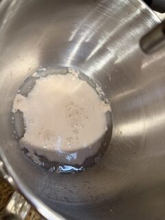 Homemade white bread dough after yeast proofing.