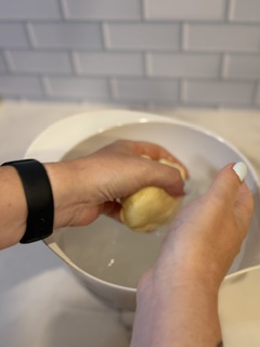 “Washing homemade butter with cold water to remove buttermilk” ✅