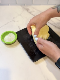 “Mixing salt into homemade butter for added flavor” ✅