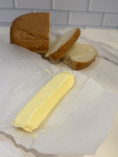 “Homemade butter shaped into a log for easy storage” ✅