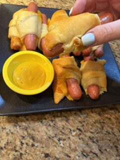 Homemade crescent Dogs with melted cheese wrapped in flaky crescent dough.