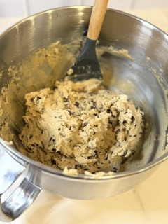 Homemade chocolate chip cookie dough ready to be scooped onto a baking sheet for baking.